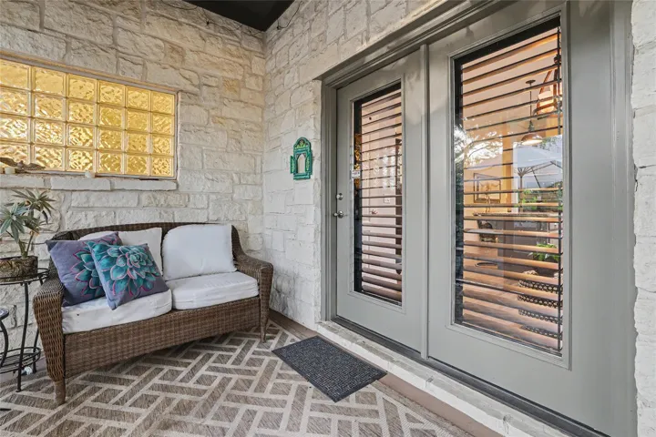 The patio is screened in and has a very cool light fixture...which you can't see in this photo)  Plantation shutters on the door and windw entering the kitchen for complete privacy...