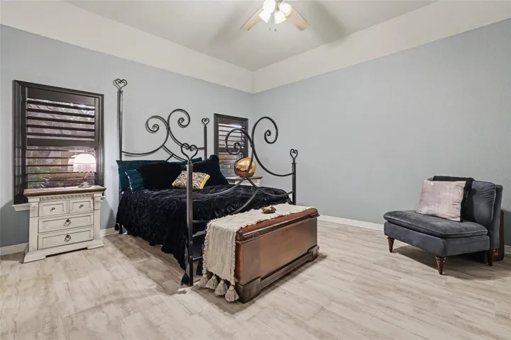 What a great place to retreat to at the end of your day.  The flooring in this room was just replaced.  Freshly painted, black Planttaion Shutters, white trim, and light gray flooring...
