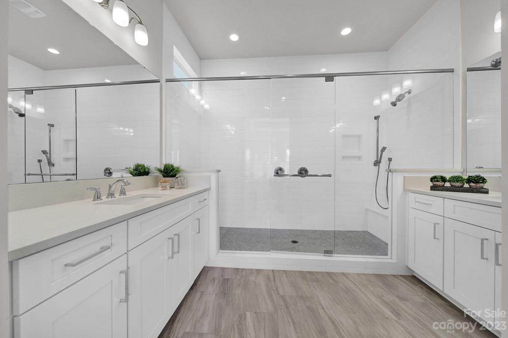 Master bathroom with dual vanities, extra large shower and water closet
