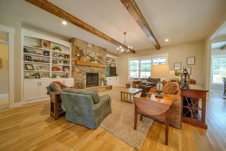 Great Room features oak flooring, built-ins and a stone fireplace!