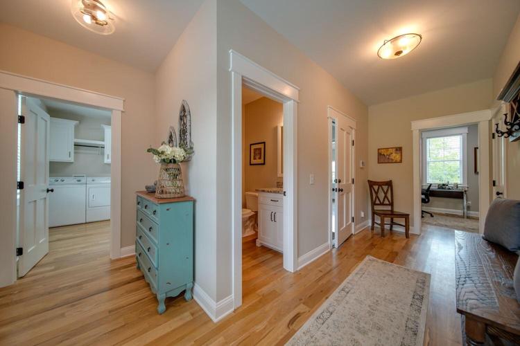 Rear hallway with access to the private Office, Laundry room, powder room and garage