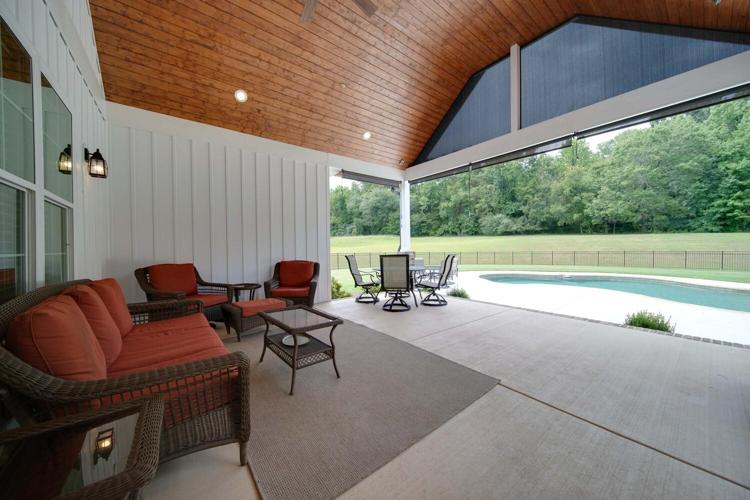 Rear Covered Porch featuring a wooden ceiling and screens