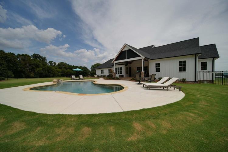 Picture yourself lounging by the pool or relaxing on the covered porch.