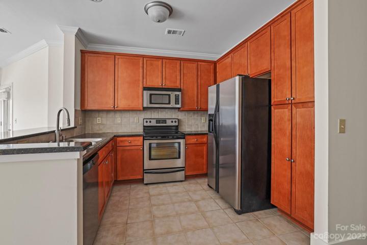 Stainless steel appliances in the kitchen.