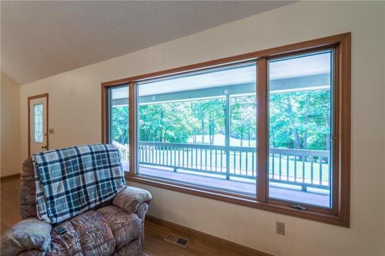 Picture window overlooking pasture in living room