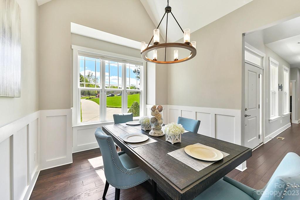 Dining Room with Vaulted Ceilings and Moldings