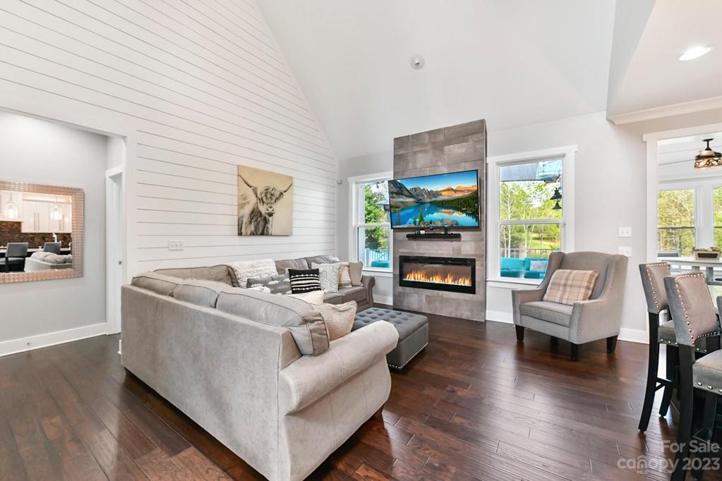 Great Room With Vaulted Ceiling and Wood Floors