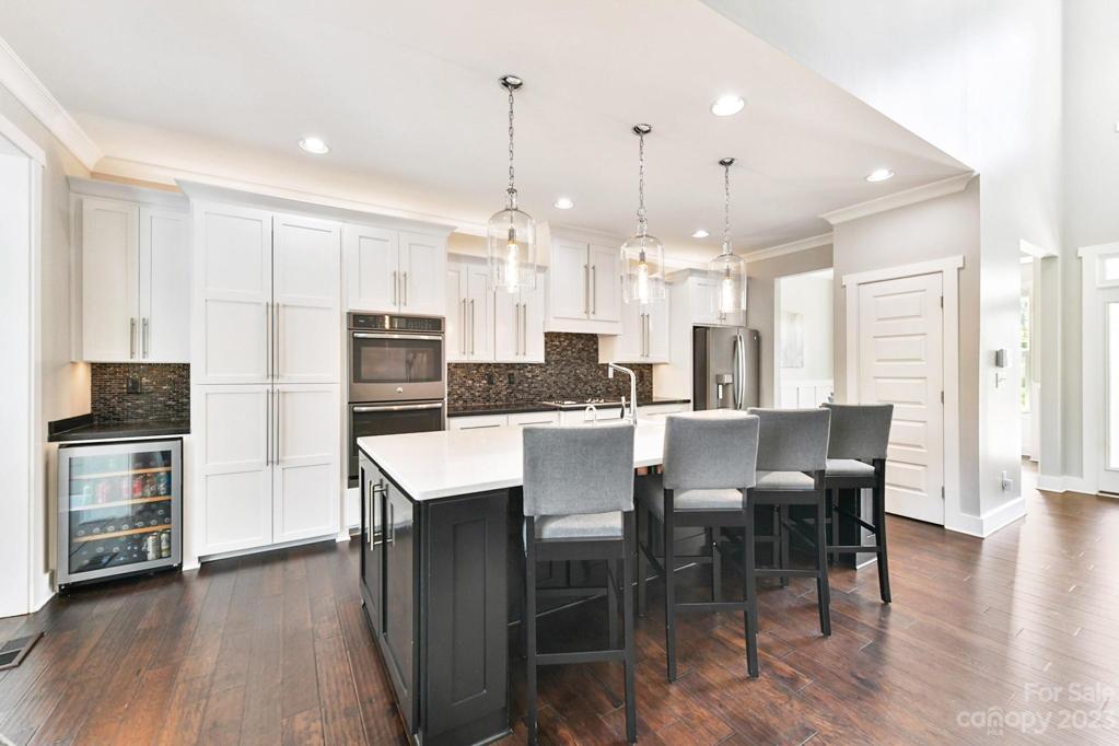 One Pantry Cabinet Plus 2nd Closet Pantry! Built-in Beverage Refrig