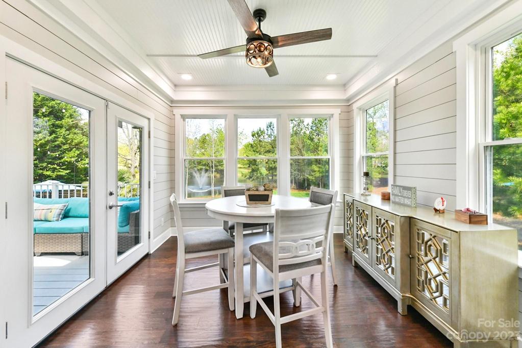 Sun lit Breakfast Room with great Views, Shiplap walls, Fan and Wood Floors