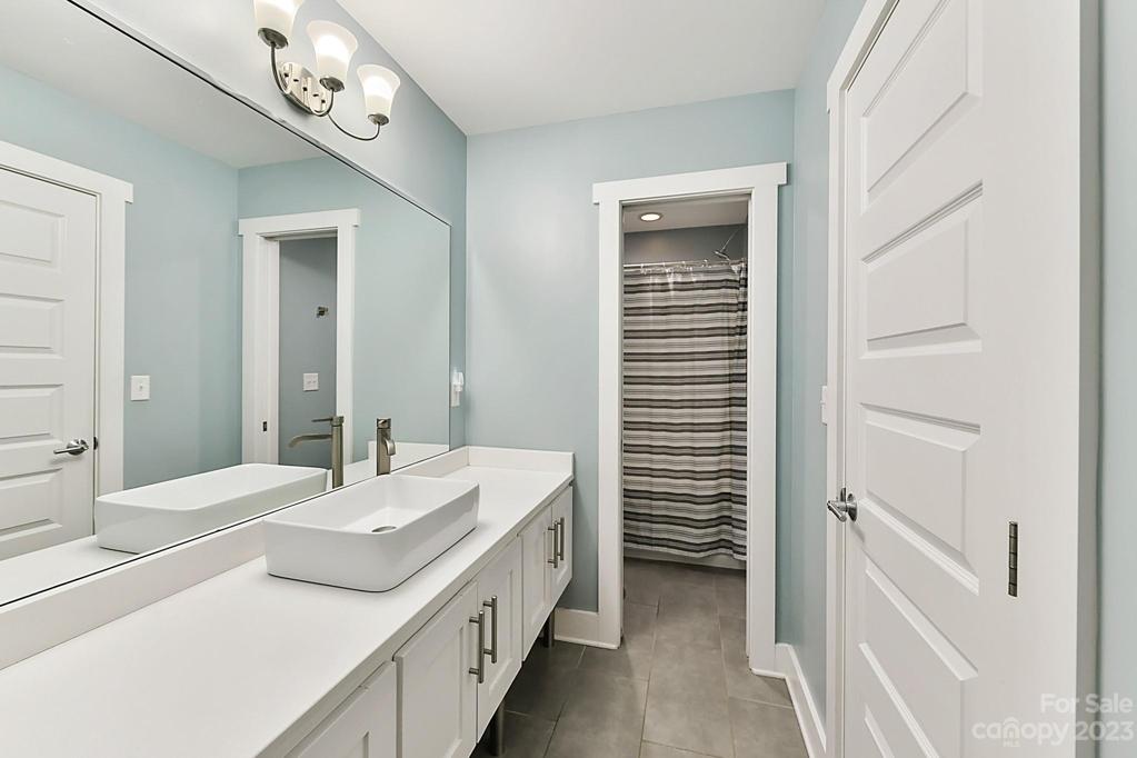 Full Bath 3 with Vessel Sink on Floating Vanity. Tiled Flooring