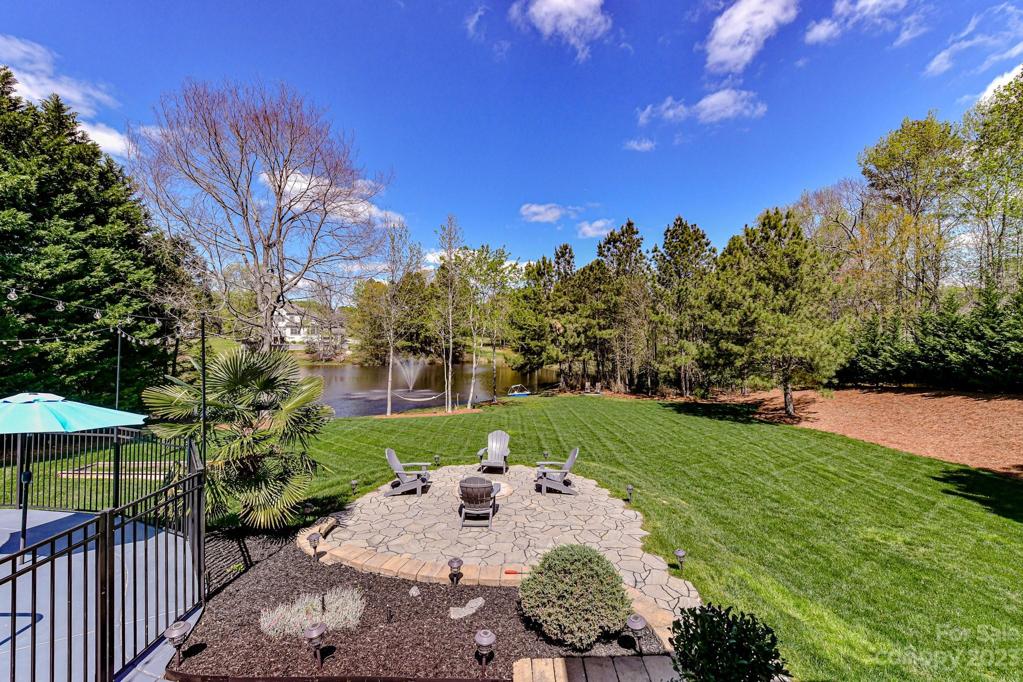 View from Deck to Firepit and Lake