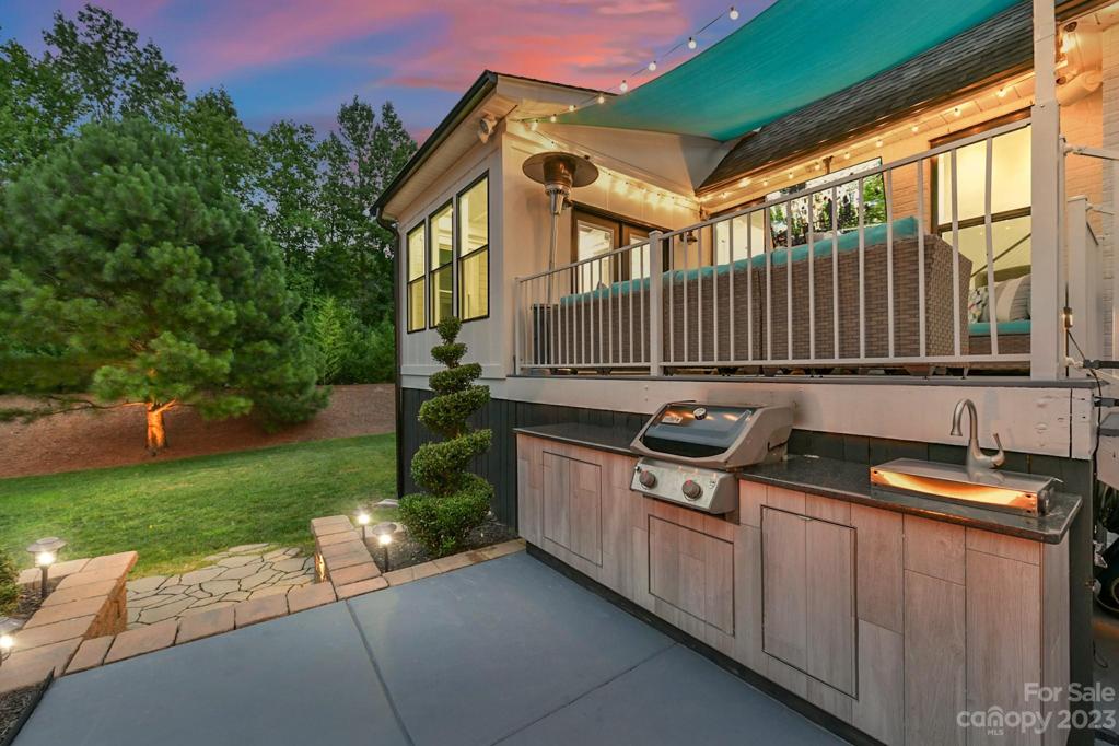 Twilight View of Built-in Grill and Landscape Lighting