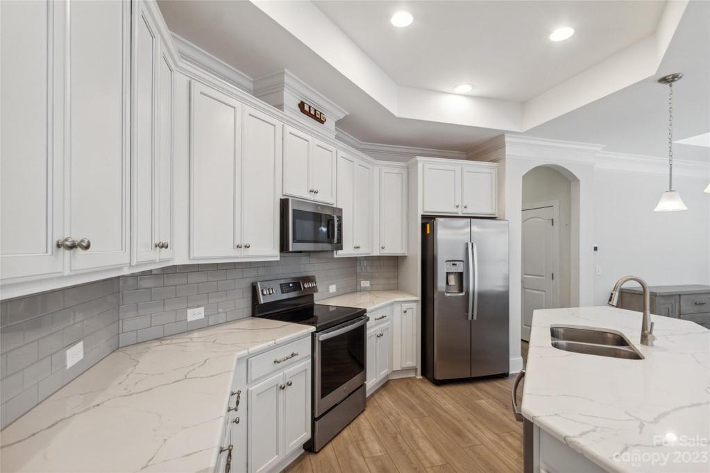 Upgraded 42" Cabinets and quartz countertops and stainless appliances.