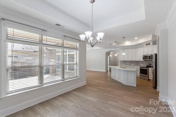 Dining Room with Trey Ceiling and opens to kitchen.