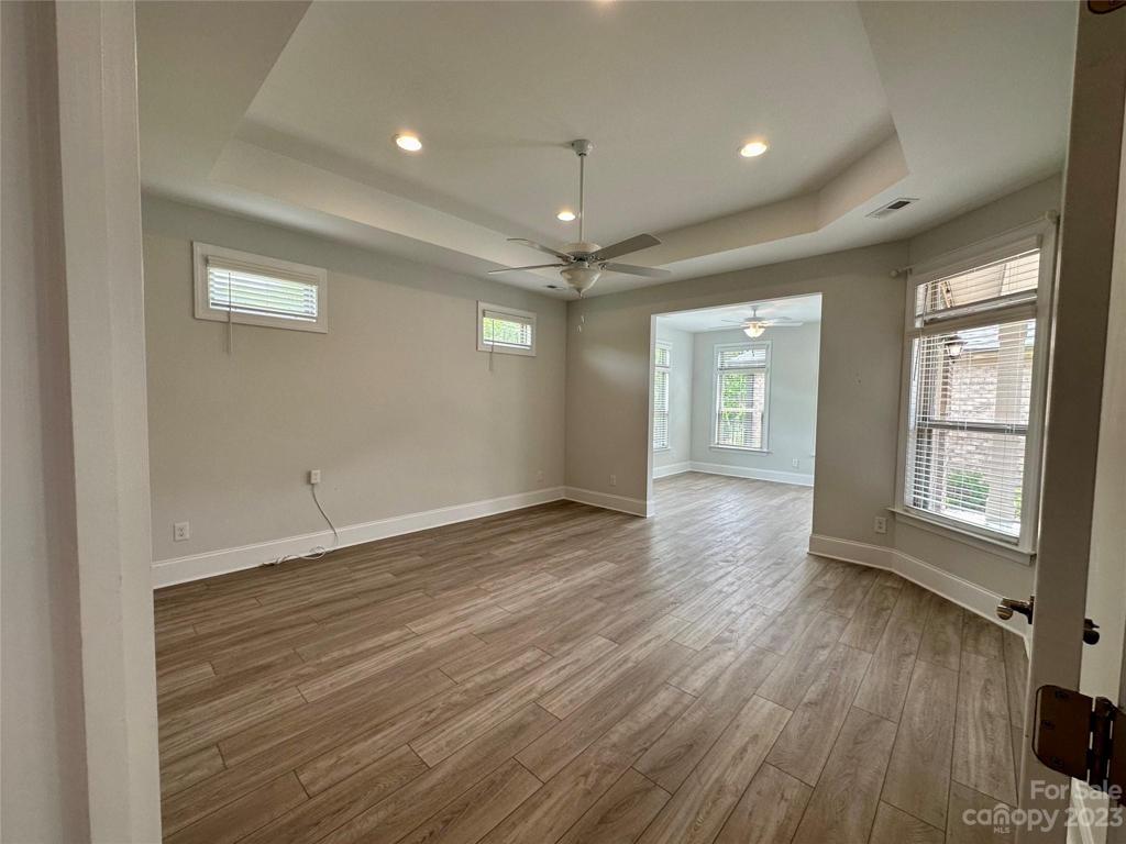 Primary bedroom with Trey ceiling, and sitting room/sunroom.