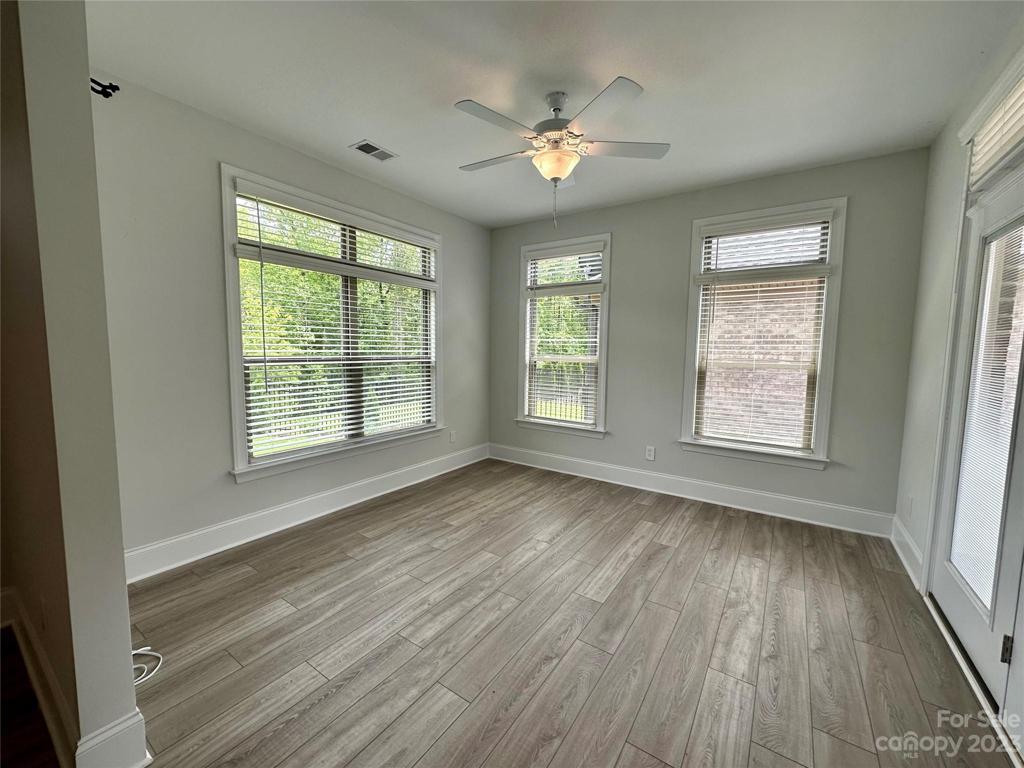 Primary Sitting Room/Sunroom with access to patio.