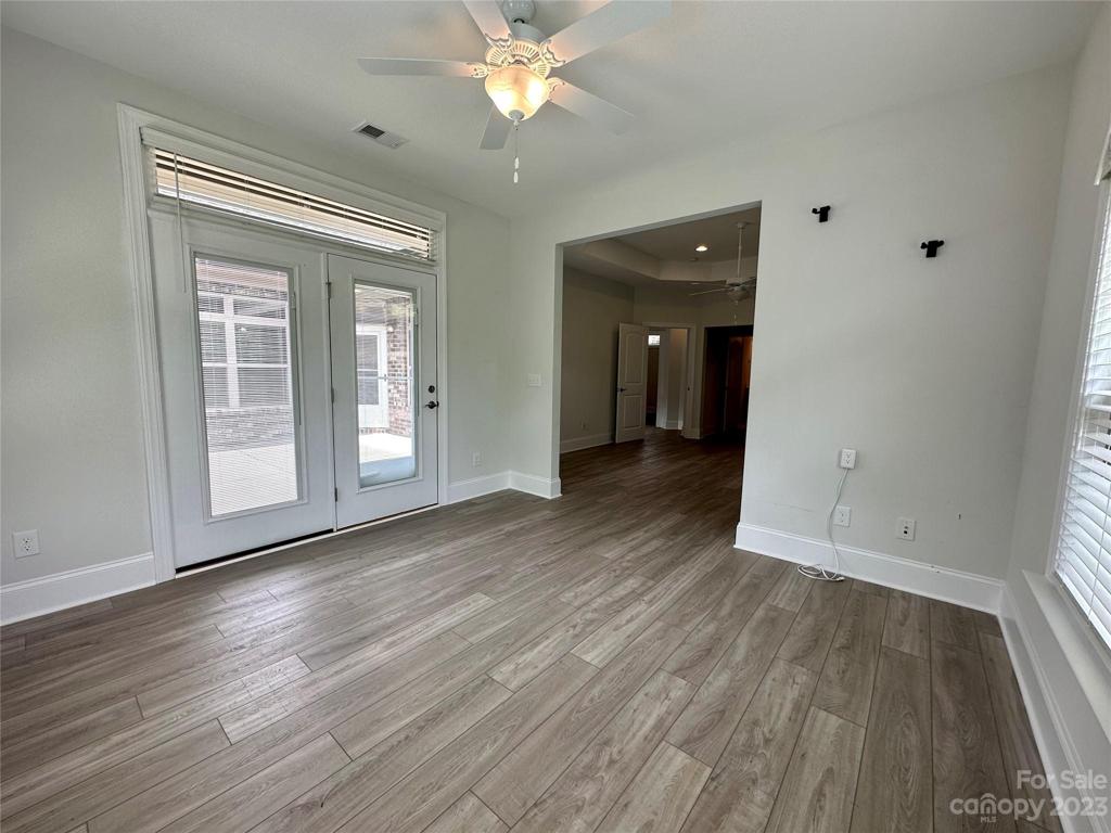 Primary Sitting Room / Sunroom with access to patio.