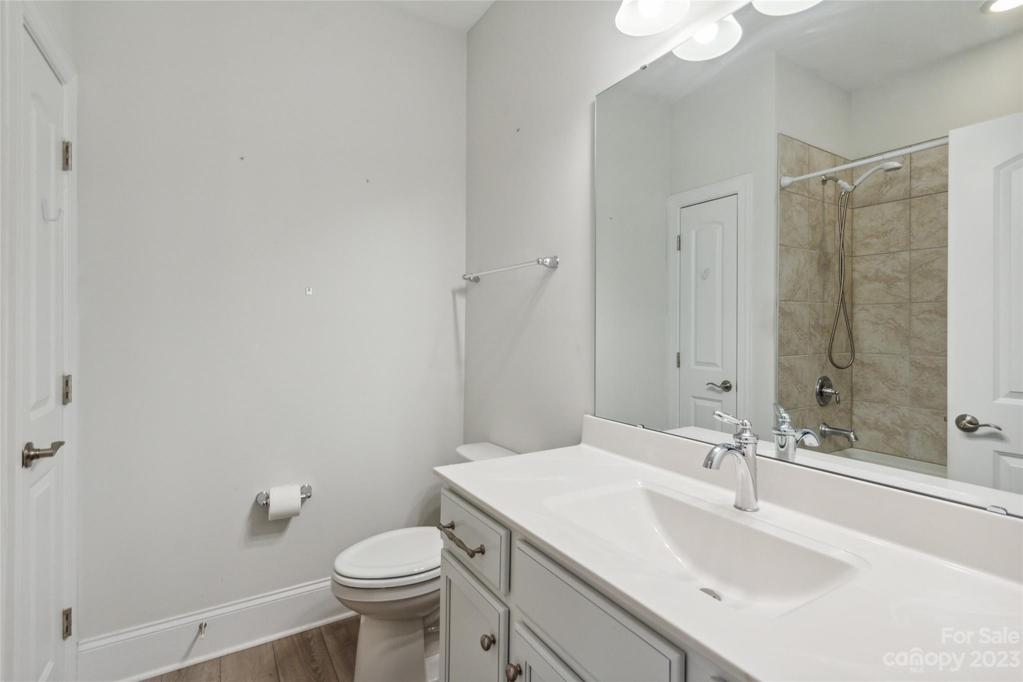 Secondary full bathroom with linen closet.