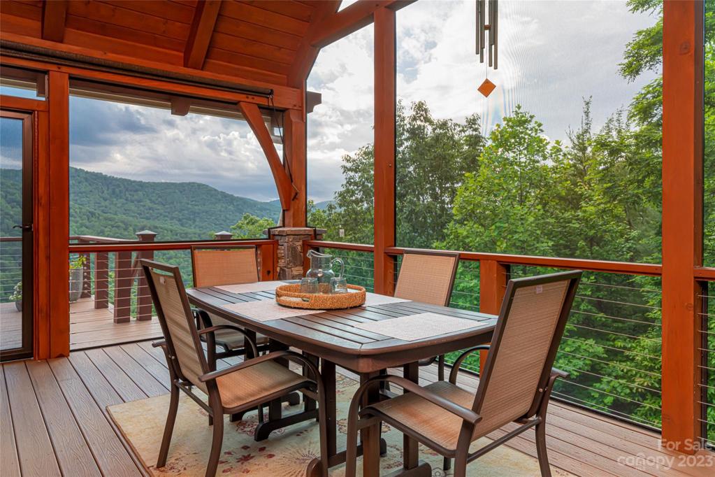 Enclosed, screened in porch allows outdoor dining