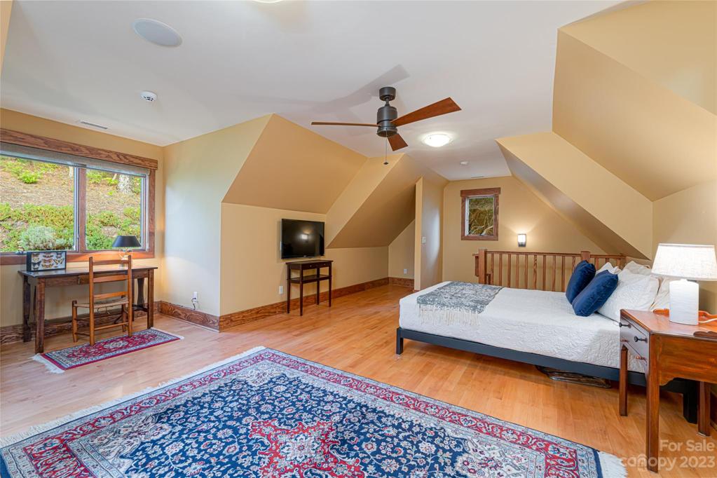 Large bedroom suite over the garage can be accessed through the lofts secret door or through its own entrance in the garage