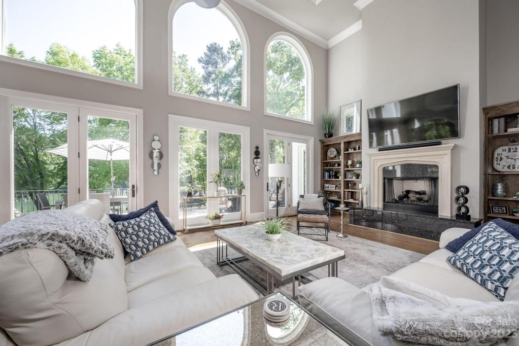2 Story Great Room with Fireplace that steps out to stone patio overlooking a backyard paradise!!!!!