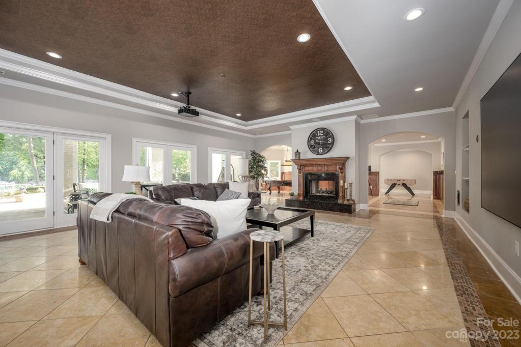 Waterfront Level Open Space Great Room with Newly Installed 120" Theatre Screen with 7.1 surround sound and a laser projector, See-Tru Fireplace, French Doors Open to Your Own Waterfront Paradise!!!!