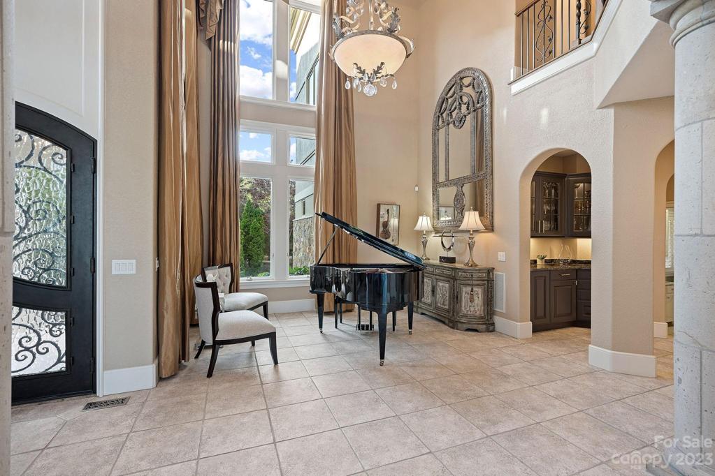 Elegant living areas are overlooked from 3rd floor balcony