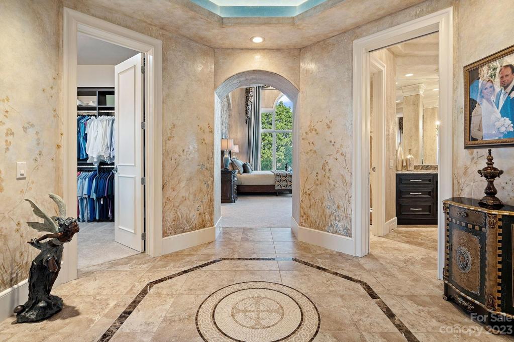 Foyer to Primary Suite, tile insert was custom designed and created in Italy