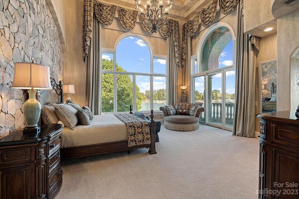2 story primary suite, arched windows and electronic shades