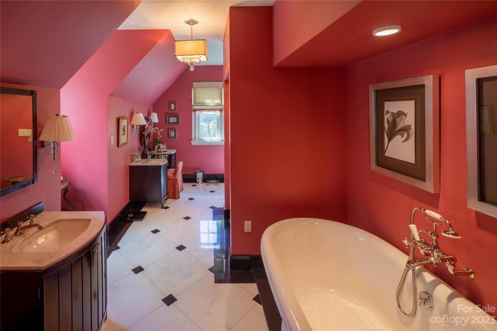 The first of two bathrooms dedicated to the primary suite