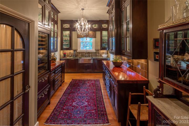 Back inside, this flawless Butler's Pantry invites memorable times in the kitchen