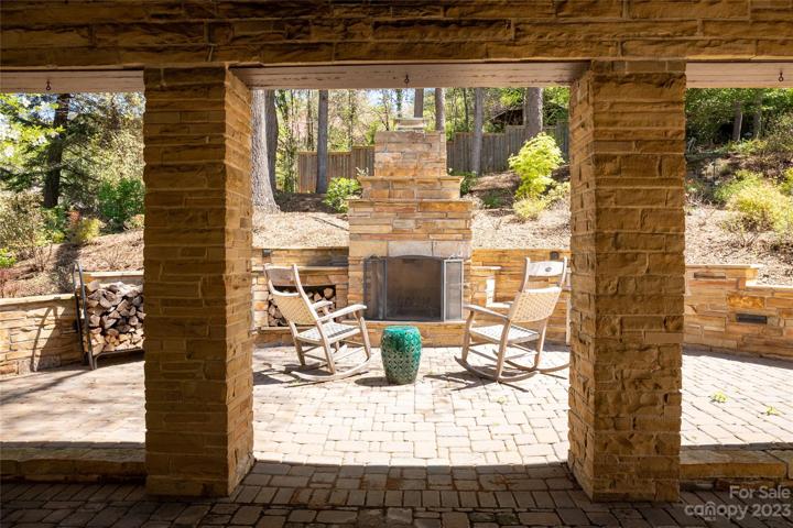 Those terrace pillars provide picture perfect frames for the wood burning outdoor fireplace - a great gathering spot