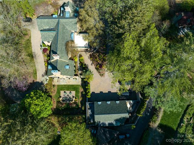 A bird's eye view of the private +/-1.17 acres...noting the main home vertically on the left and the 3 car garage horizontally on the center bottom
