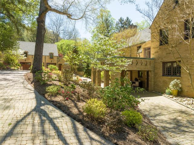 Beneath that covered terrace on the right, an outdoor kitchen area offers an ease of living