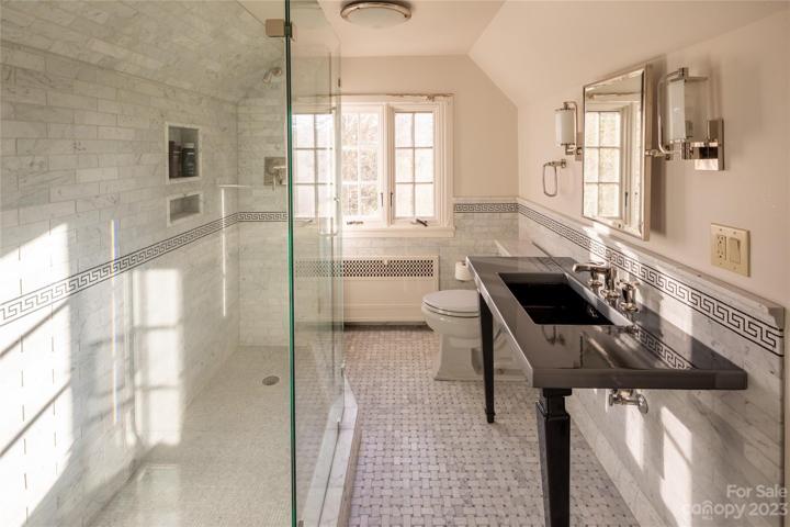 Amazingly spacious step in shower in this beautifully renovated bathroom