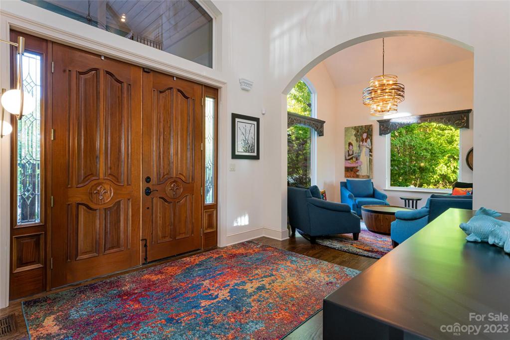Stunning doors, window treatments and arched doorways continue to surprise you as you walk into the house...
