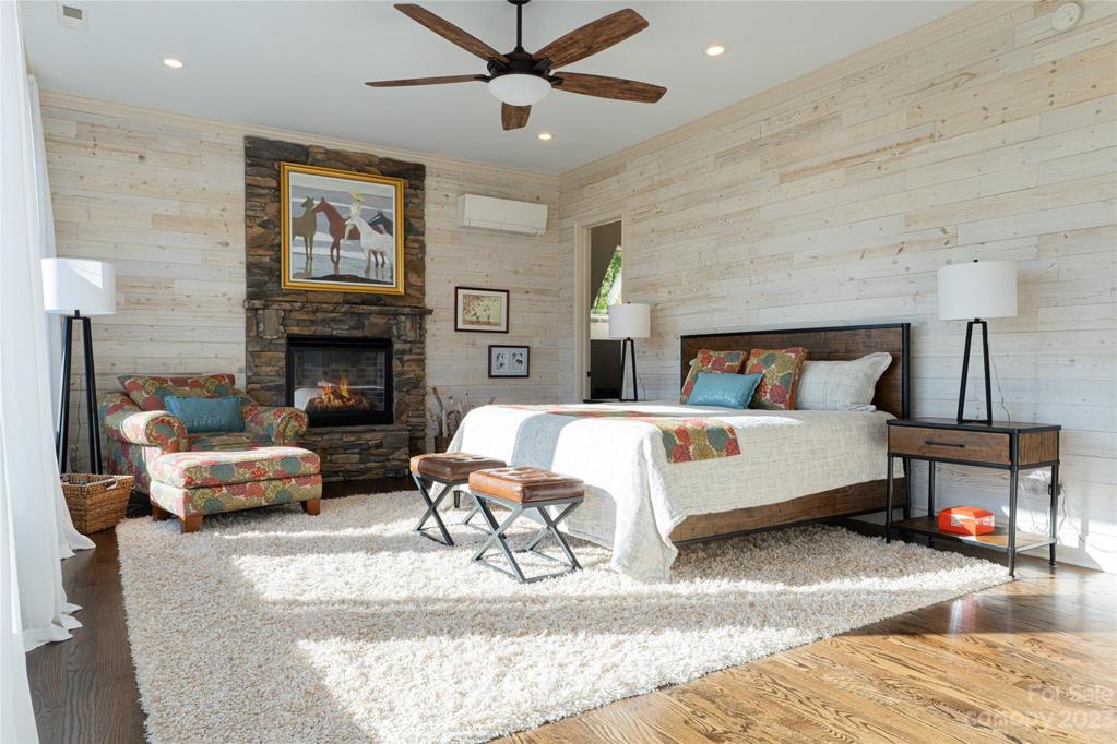 With muted hues the shiplap wall panels make a huge statement in the primary suite...