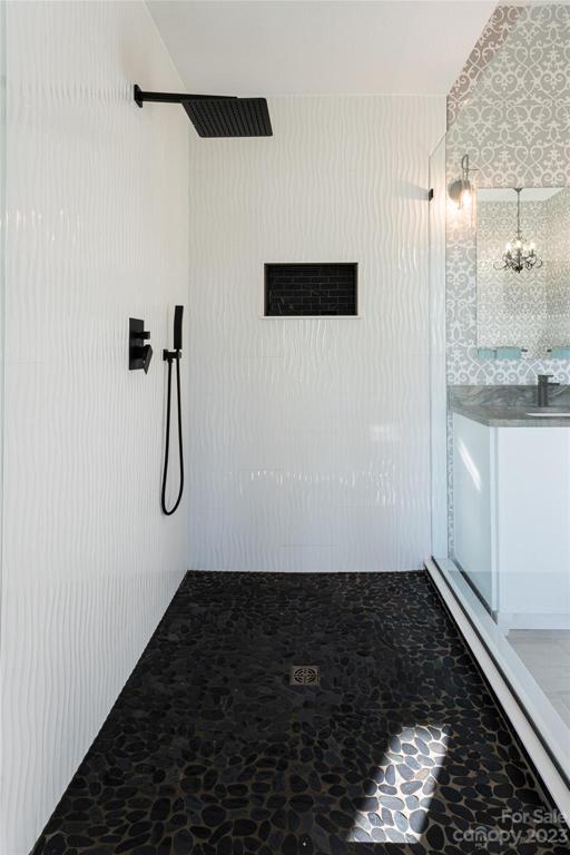 A luxurious rain shower in the primary bathroom...