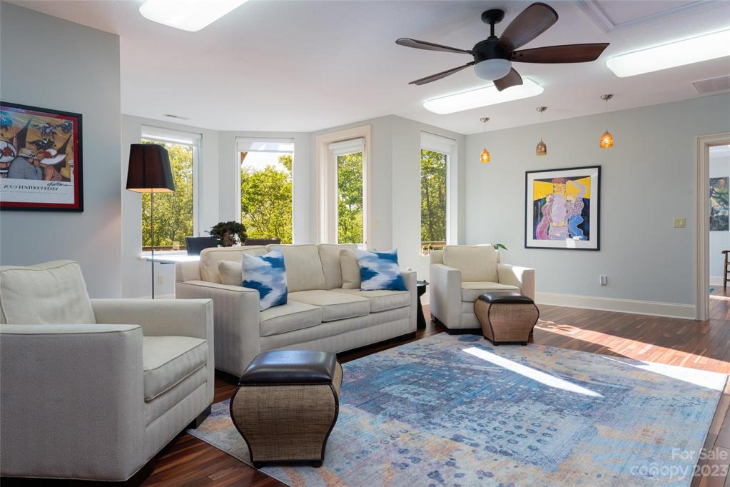 A spacious basement level originally intended to be a separate living space has multiple bedroom options, a full bath with steam shower, office space and a gym...