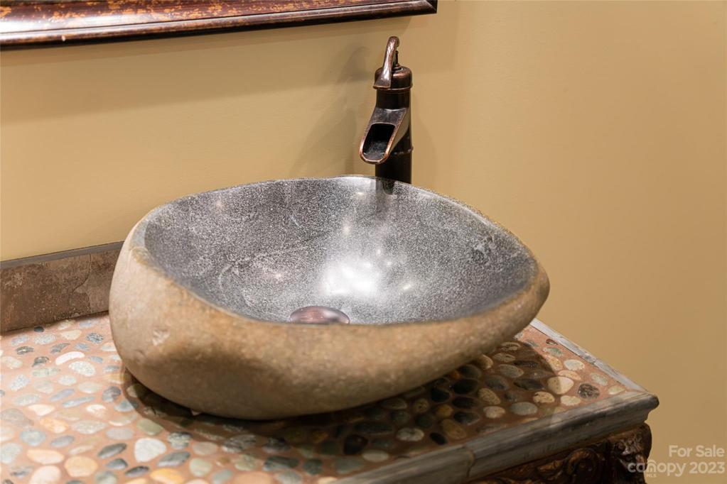 Artistic features of the basement level spacious full bath...