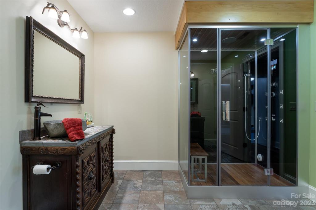 Finished basement bathroom with steam shower...