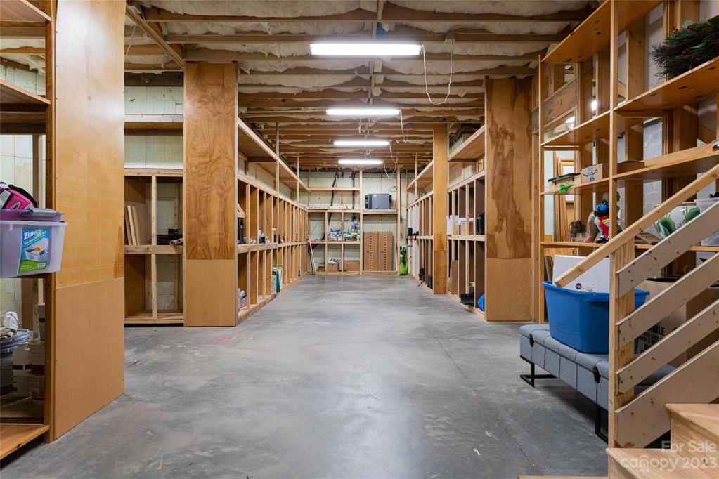 And then THIS... incredible storage in the unfinished basement!  Current owners considered putting a golf driving range simulator down here in one of the rooms!