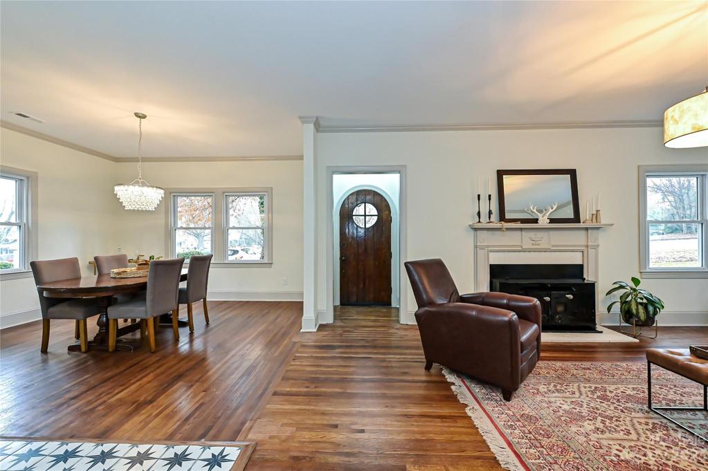 Interior features original hardwoods, open floor plan and lots of natural light