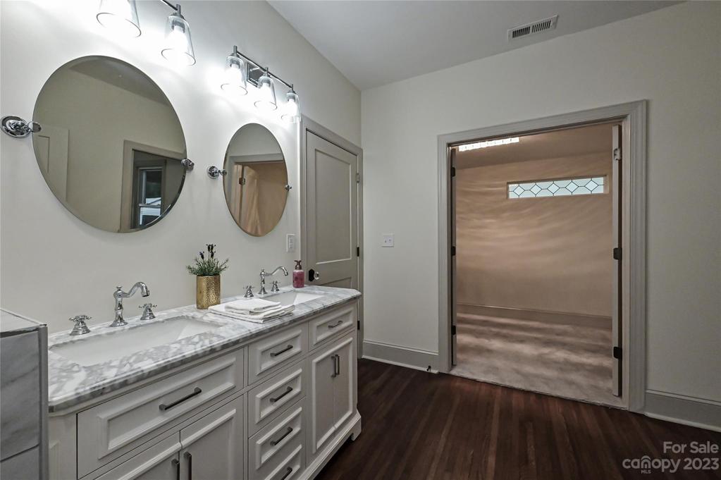 Shining polished chrome fixtures offers a timeless look in this spa like bathroom