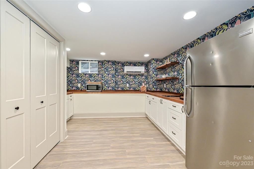 Each room in basement has a dedicated mini split used by remote access to set temp to your desired level