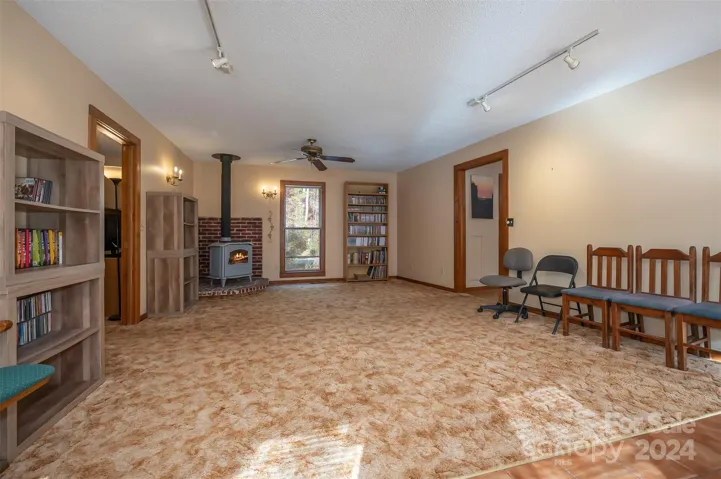 Living room from the front door. Door to right leads to kitchen. Door to left leads to a bedroom.