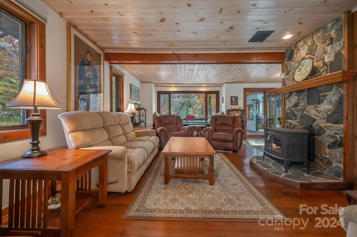 Family room looking toward the window seat. Door to the right leads to the deck.