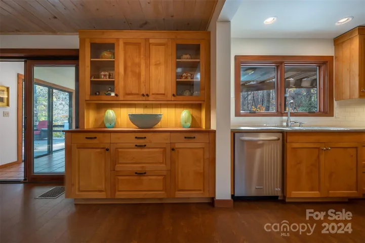 Custom built-ins and view of part of the kitchen.