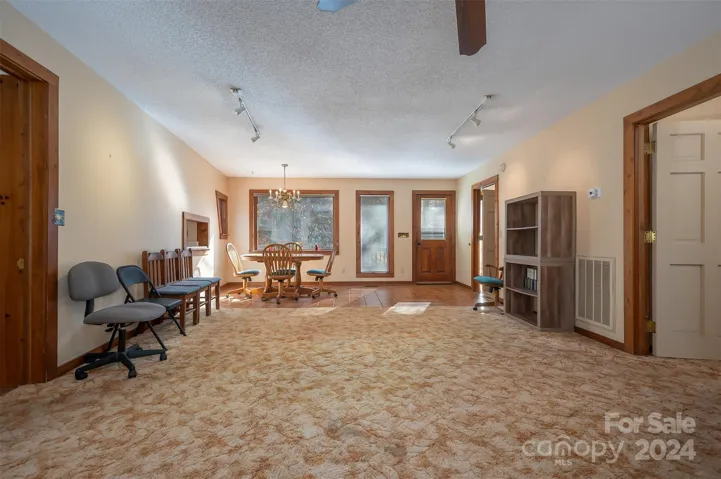 View toward dining area and front door. Both bedrooms on the right.