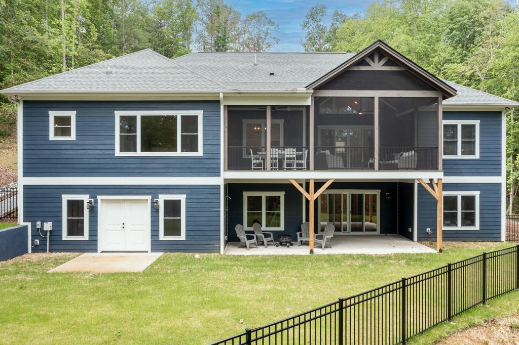 Back of home with fenced area